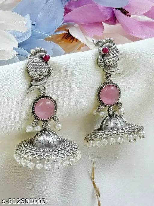 Charming oxidized silver jhumka earrings with a unique antique design and beautiful pink accents. - NARIX INDIA 